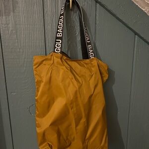 BAGGU Bronze Tote Bag with Black Straps and White Lettering